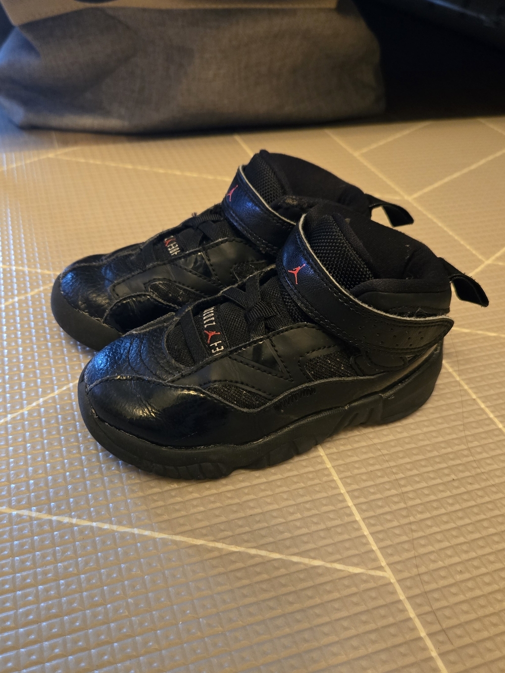 Jordan Kids Black Sneakers with Red Jumpman Accent